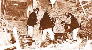 Fireman in bomb wreckage